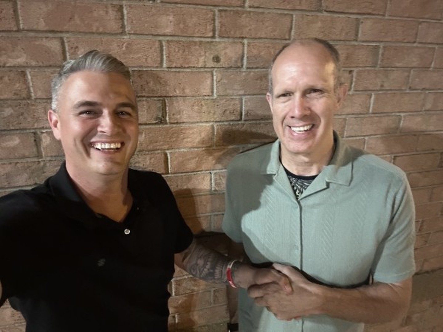 Mike shaking hands with a satisfied seller in Exeter, Ontario